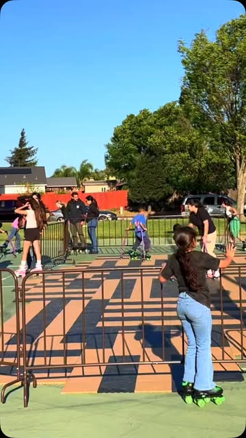 Kids skating on a Roll W. Me outdoor rink at a park