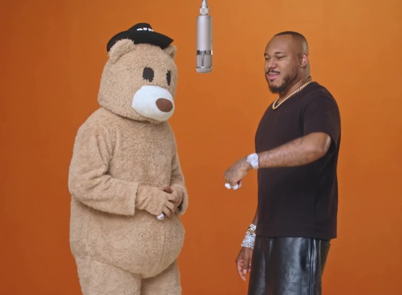 The Roll W. Me bear mascot dancing with the owner